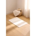 Dywanik ze sztucznego futra z geometrycznym motywem 90×60 cm, kremowy - Atmosphera