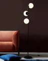 Czarna lampa podłogowa Lilly z trzema szklanymi kloszami NORDLUX